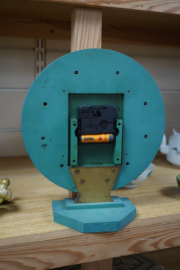 An Art Deco style circular mantle clock, 25cm. Condition - quartz movement